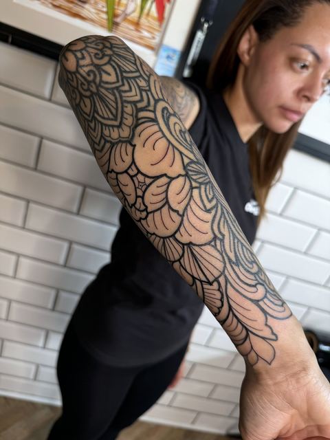 Ornamental floral sleeve in black linework